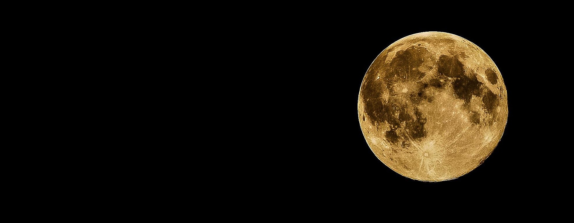 Full moon, yellow in color.